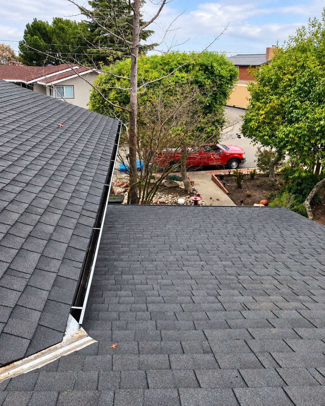 Residential roof edge and gutter after debris removal